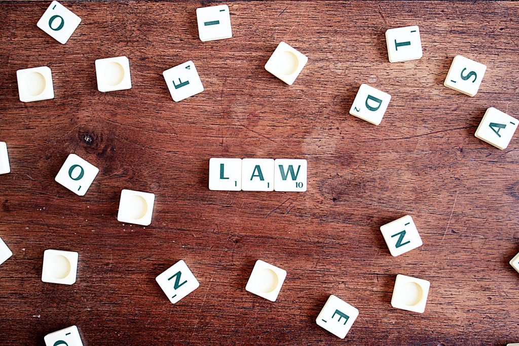 scrabble pieces spelling out law